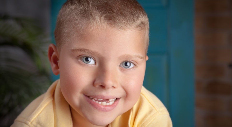 Professional child photography headshot portrait of a young boy