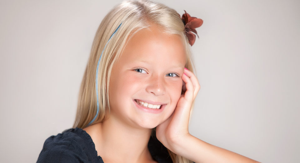 Child Photography of a young girl with feather hair accessory