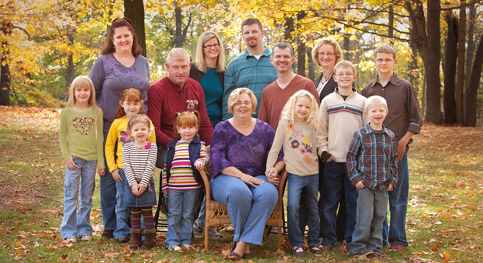 Extended family photo with kids and grandkids in outdoor natural fall setting