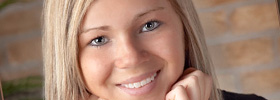 Close-up of a high school senior girl smiling and posed for photography image