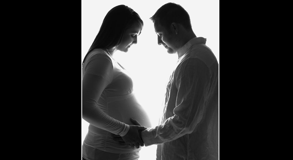 Couples maternity photography on white with backlit photography effect