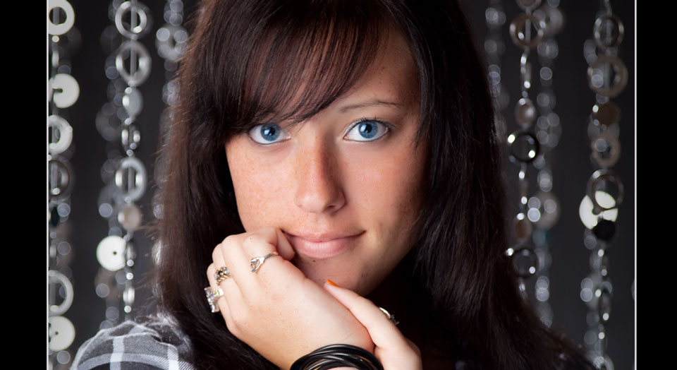 Close-up of High School Senior Photography with radiant silvery shimmer and shine